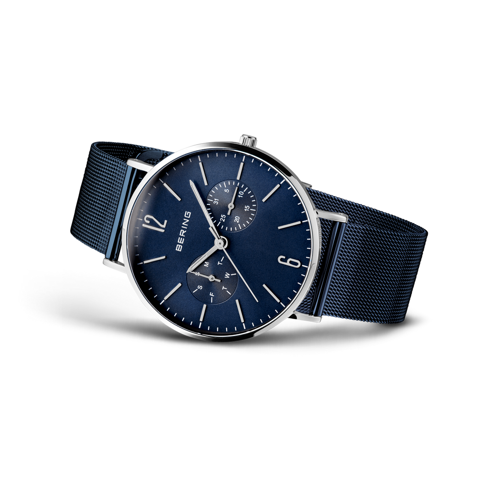 BERING wristwatch with blue dial and navy mesh band, angled view
