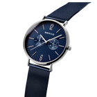 BERING wristwatch with dark blue dial, silver case, and black woven fabric strap, angled view showing dial and band.