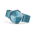 Wristwatch with light blue dial and matching mesh band, displayed at three-quarter angle