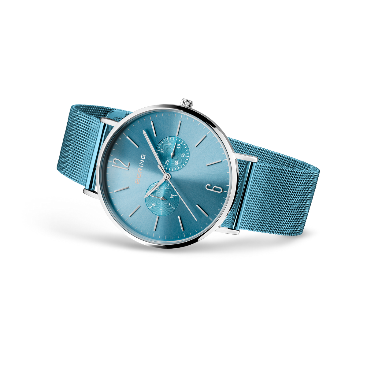 Wristwatch with light blue dial and matching mesh band, displayed at three-quarter angle