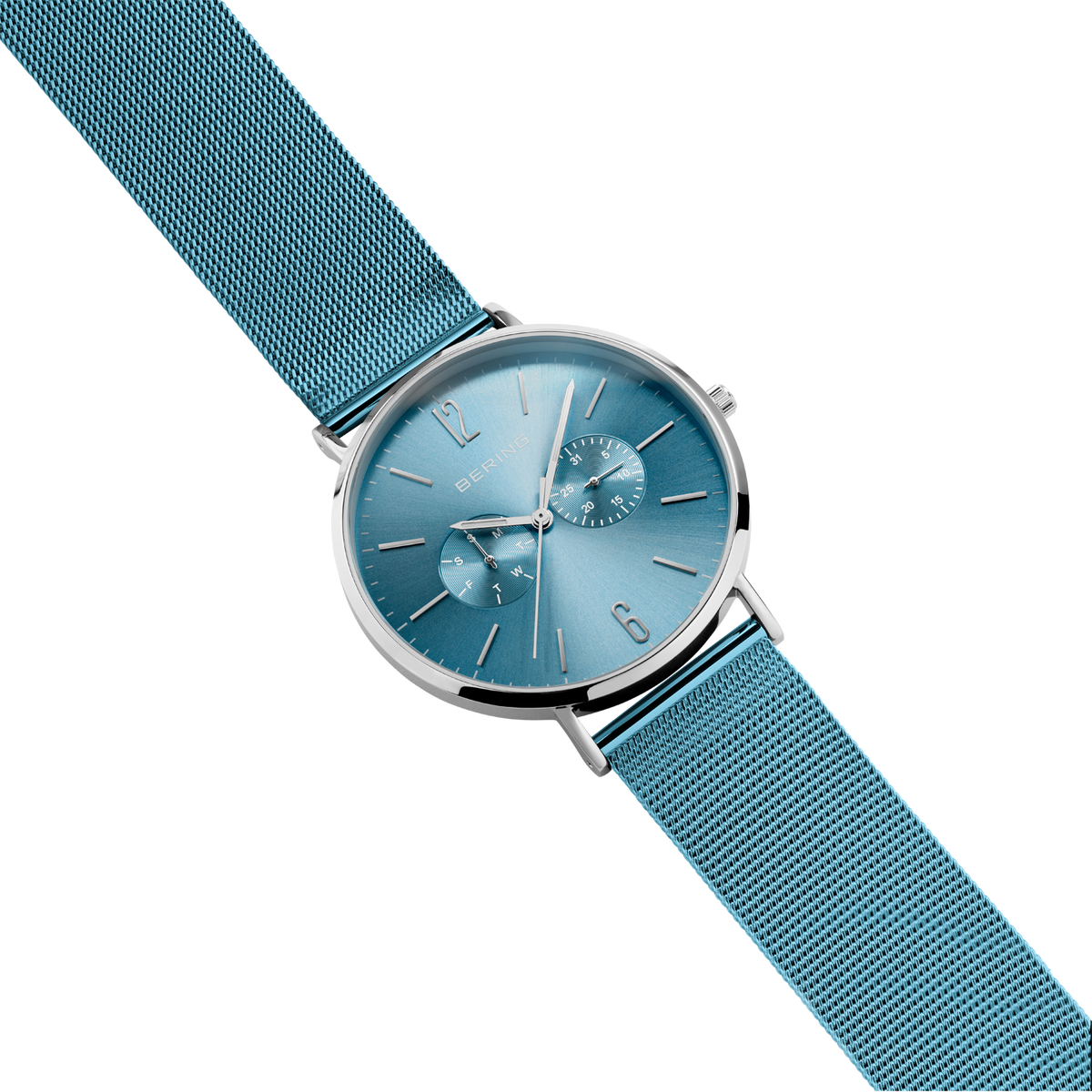 Wristwatch at an angle with teal mesh strap, silver case, blue dial, and chronograph subdials.