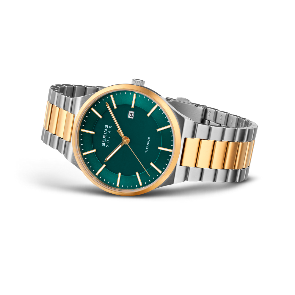 Reloj de pulsera con esfera azul verdosa y pulsera de dos tonos plata y oro.