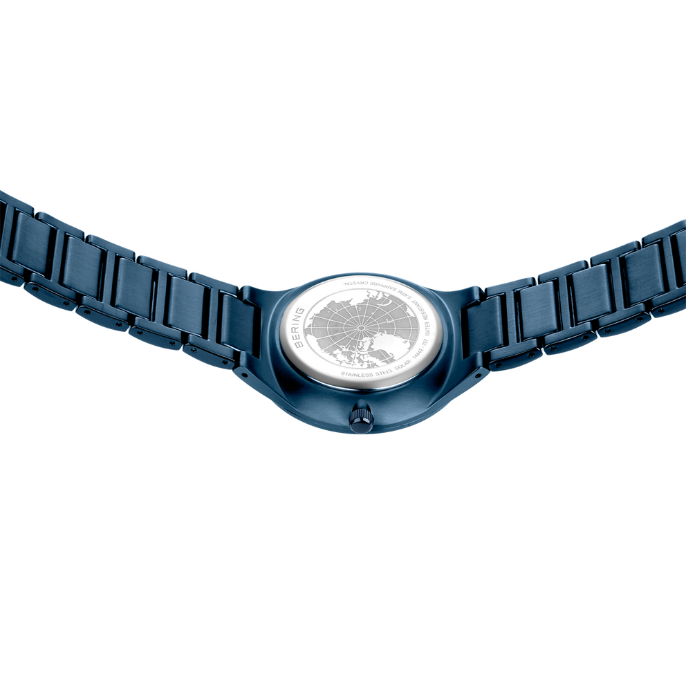 Blue metal link bracelet with rectangular links and white dial face viewed from above