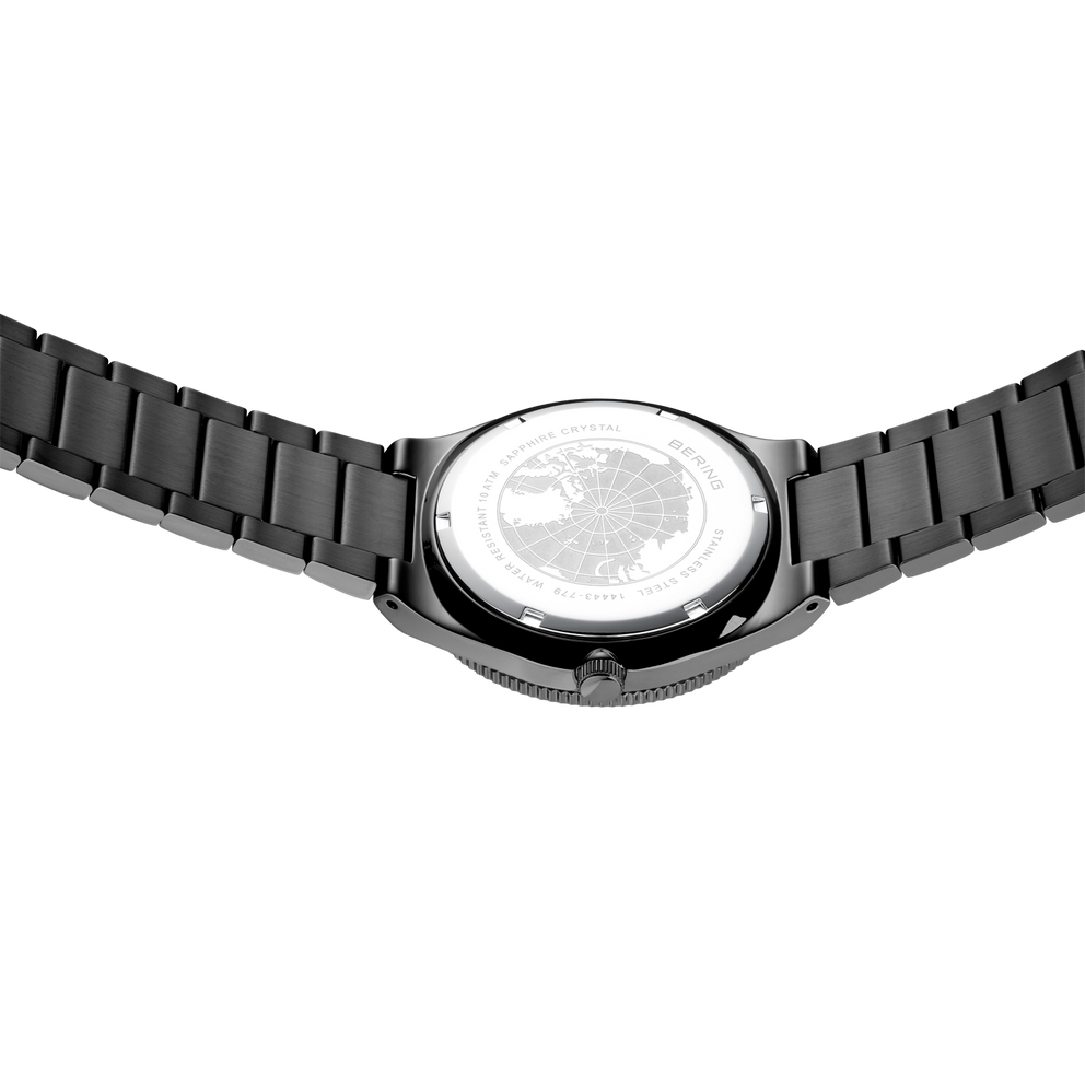 Back view of watch with black link bracelet, silver case visible from underneath