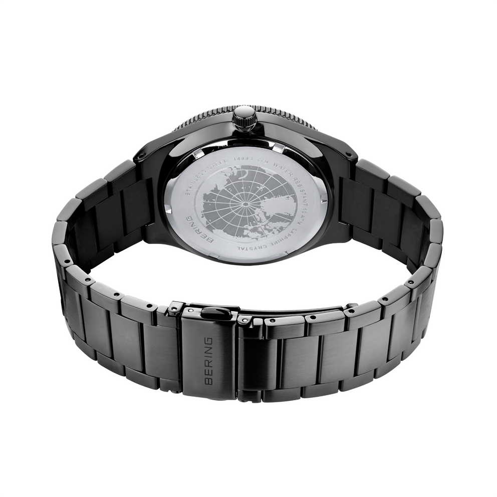 Rear view of black steel bracelet watch showing caseback with movement detail and center link clasp
