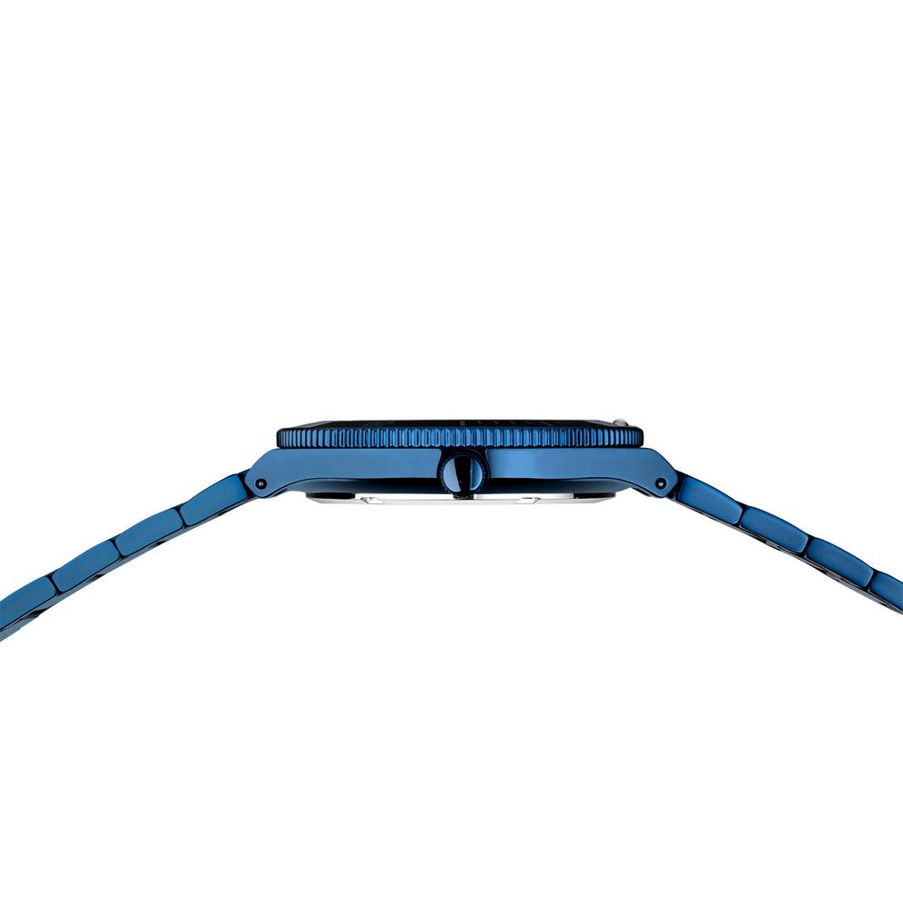 Blue watch case with textured top and link bracelet, shot from above.