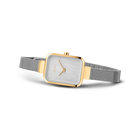 Square-face wristwatch with silver dial and gold-tone bezel, fitted with silver mesh band.