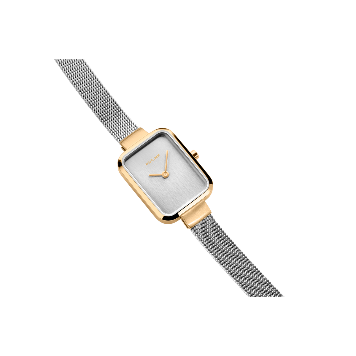 Rectangular watch with rose gold case and silver steel mesh strap, angled view