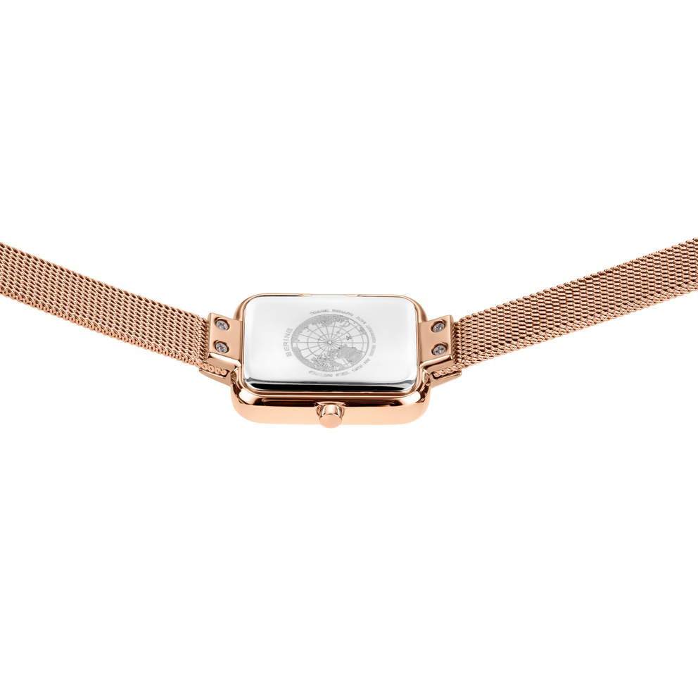 Reloj rectangular en oro rosa con esfera blanca y pulsera de malla a juego, vista frontal