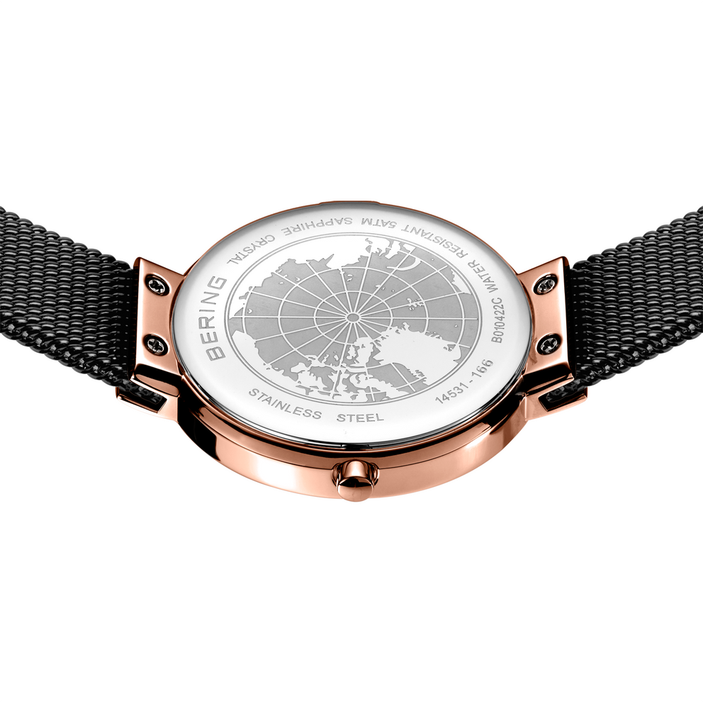 Rose-gold watch with world map dial, black mesh strap, case-back visible.