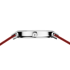 Caja de reloj con asas cuadradas de acero inoxidable y correas rojas de tela tejida, vista superior.