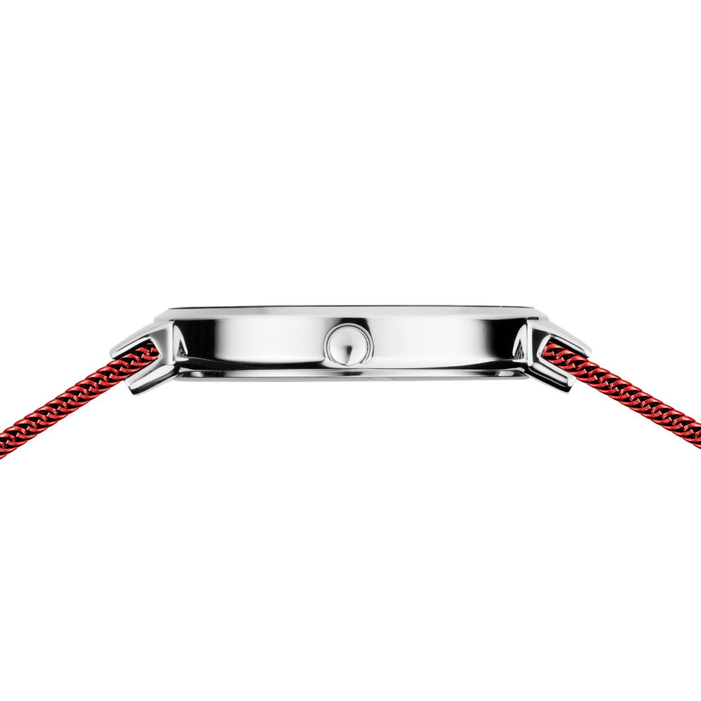 Caja de reloj con asas cuadradas de acero inoxidable y correas rojas de tela tejida, vista superior.
