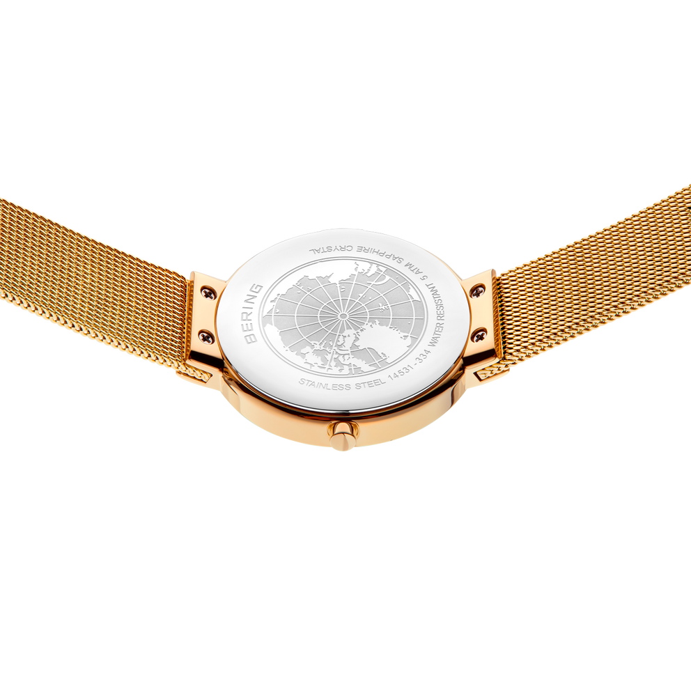 Pulsera malla champagne con fondo de caja zafiro transparente mostrando el movimiento