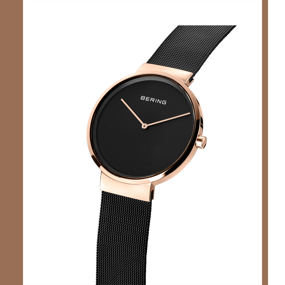 Orologio BERING con cassa in oro rosa, quadrante nero e cinturino maglia nera