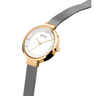 Round rose gold watch with white dial and gray mesh strap, angled to display case and band.