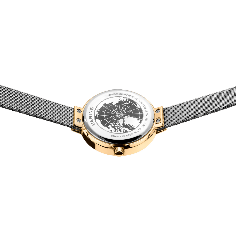 Wristwatch with globe design on white dial, rose gold case and gunmetal mesh band, top-down view.
