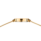 Gold-tone watch case with mesh-style bracelet, detail shot showing the case and band connection