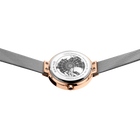 Top-down view of rose gold watch with white dial and grey mesh band