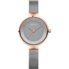 Minimalist wristwatch with rose gold case, gray dial, and silver mesh bracelet.