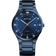 Donkerblauw BERING titaniumhorloge met rond wijzerplaat, witte indexen, oranje wijzers en metalen armband.