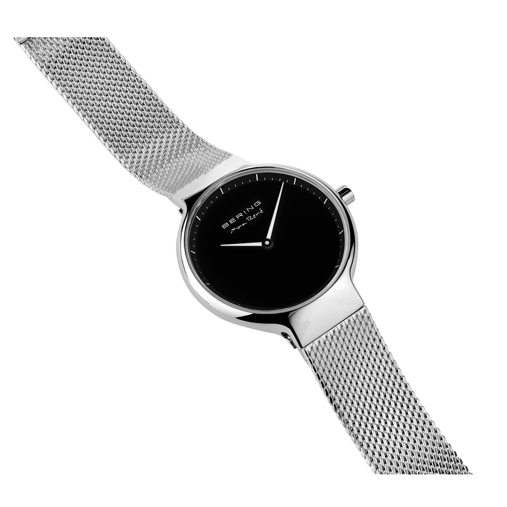 Watch with mesh band extended in diagonal layout, displaying full strap length