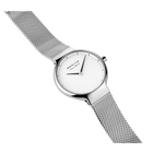 BERING minimalist wristwatch with white dial and mesh metal strap, angled profile view