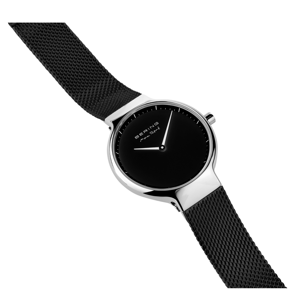 BERING watch with black mesh band extended diagonally, case and band texture visible