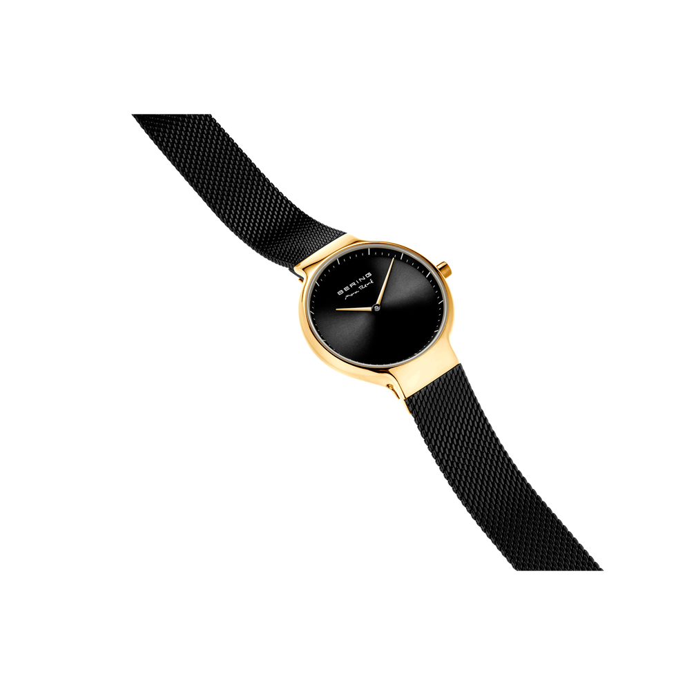 BERING watch with gold-tone case, textured black mesh band, and minimalist black dial