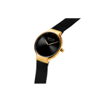 Gold-toned round watch with black dial and black mesh strap, angled view from above.