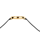 Gold rectangular watch case with black braided strap attached at lugs.