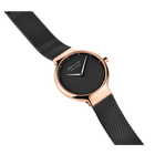 Rose gold round watch with black dial and minimalist hands, black mesh metal band angled across white background.