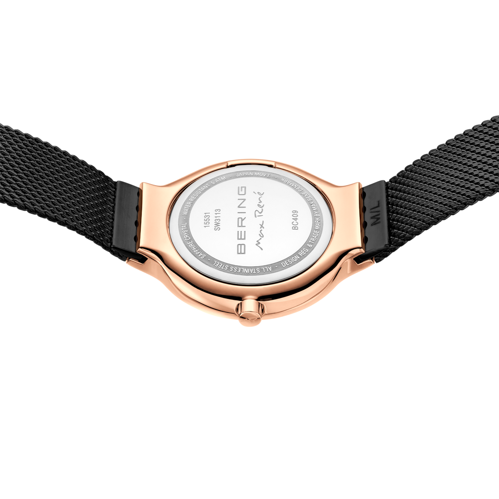 Watch case back and strap, rose gold finish with BERING dial text visible on case back.
