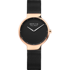 Round-cased BERING wristwatch with rose-gold finish, black dial, and woven metal band