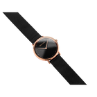 Rose gold watch with black dial and fabric strap, displayed at a diagonal angle
