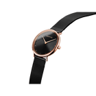 BERING wristwatch, rose gold case, black dial, black mesh strap, side angle view