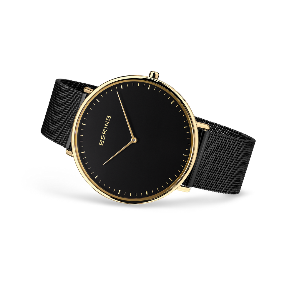 BERING horloge met zwarte wijzerplaat, gouden kast en zwart textielbandje