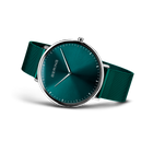 BERING wristwatch with teal dial, silver case, and teal fabric strap