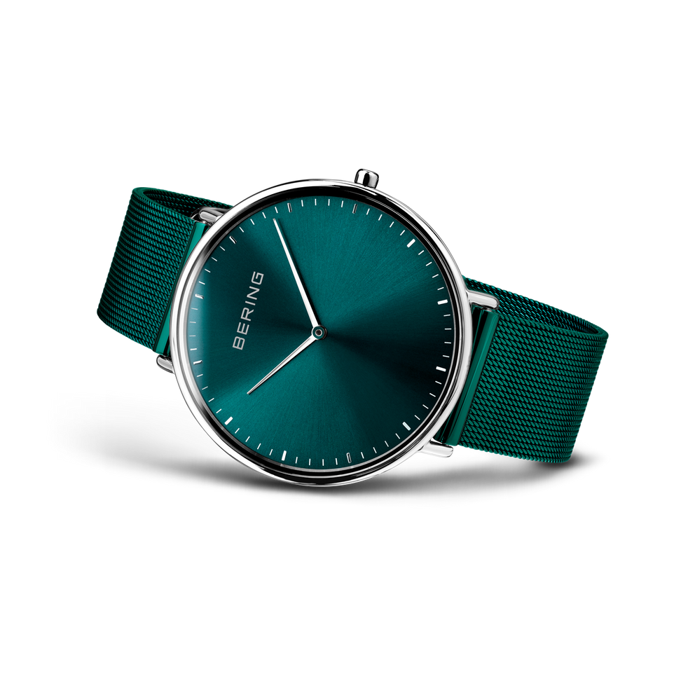 BERING wristwatch with teal dial, silver case, and teal fabric strap