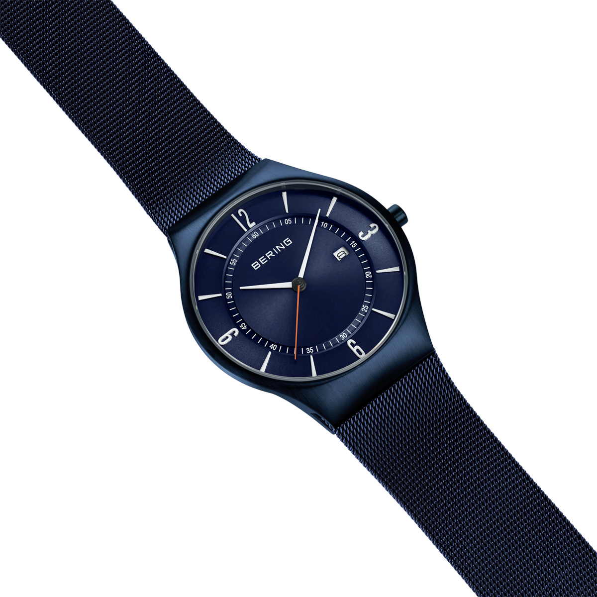 BERING wristwatch with dark blue dial and black case, displayed at angle with dark blue mesh strap against light blue background.