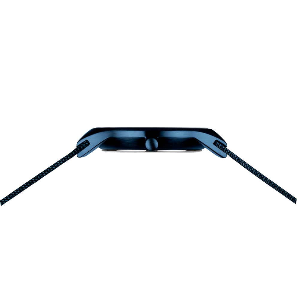 Blue watch case viewed from rear with rounded edges and dark braided fabric straps
