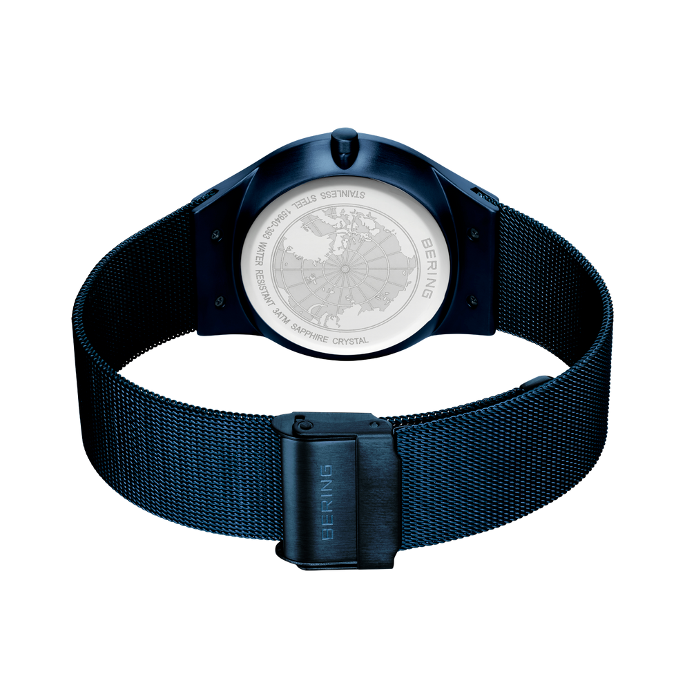 Back view of BERING wristwatch with navy mesh band and rectangular buckle.