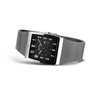 Rectangular black dial watch with white numerals and hands, silver mesh metal band, photographed at an angle.