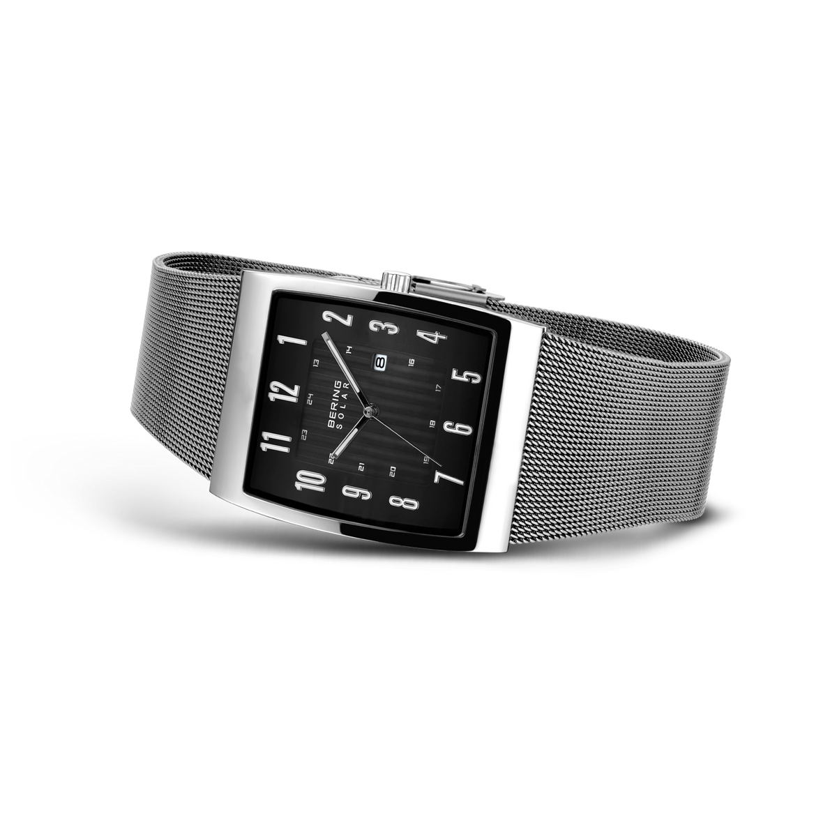 Rectangular black dial watch with white numerals and hands, silver mesh metal band, photographed at an angle.