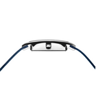 Watch viewed from above, polished case edge visible between blue woven straps with white accent details.