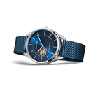 Watch with silver case, dark blue dial with white markers, and blue textile strap, side view showing transparent center