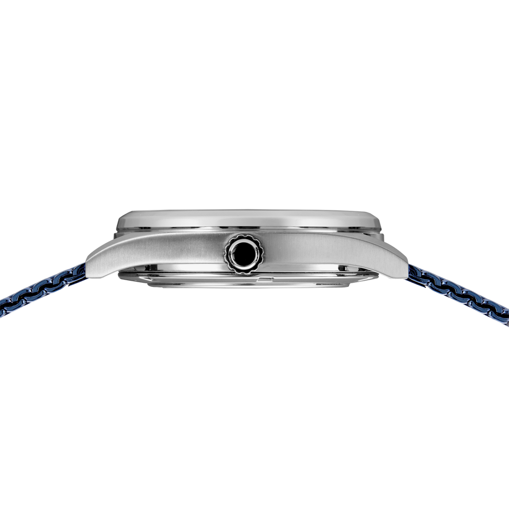 Watch case from side profile, showing brushed silver case with crown, attached to blue woven fabric strap.