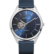 Orologio automatico BERING argentato, quadrante blu, indici bianchi, finestra aperta mostra movimento dorato, cinturino maglia blu.