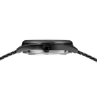 Side profile of the watch with round black case, silver accent band, and dark bracelet.