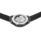 Watch back with transparent case revealing the visible movement, black mesh band