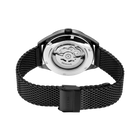 Watch shown from caseback with visible automatic movement, silver round case, and black mesh metal strap.